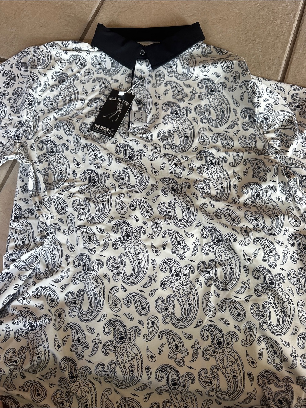 The drive clothing black/navy stretch gold polo 

New with tags in packaging